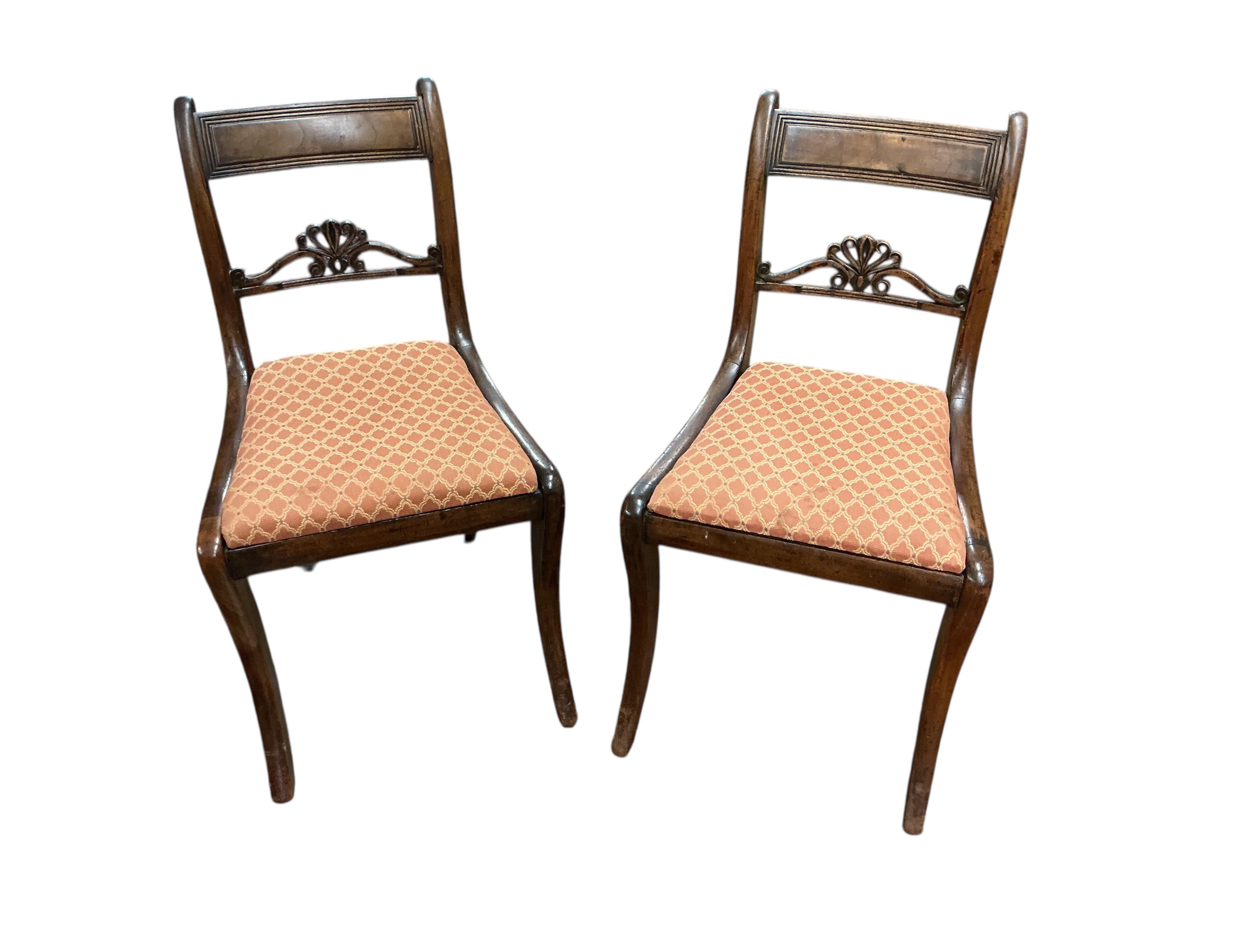 A set of eight Regency mahogany dining chairs, two with arms.